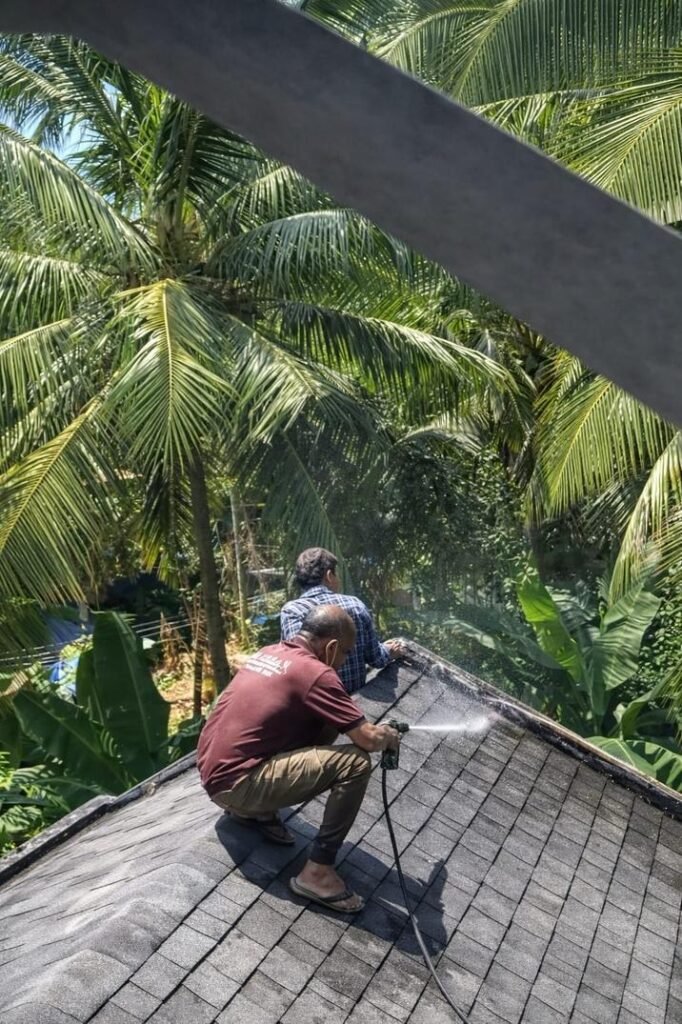 Professional cleaning of house exterior using high pressure washing in Koyilandy